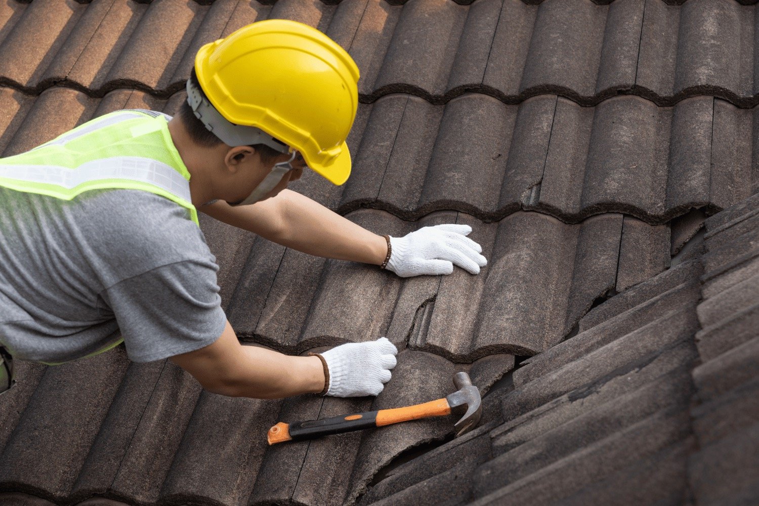 Roofing crew applying underlayment and flashing during residential install