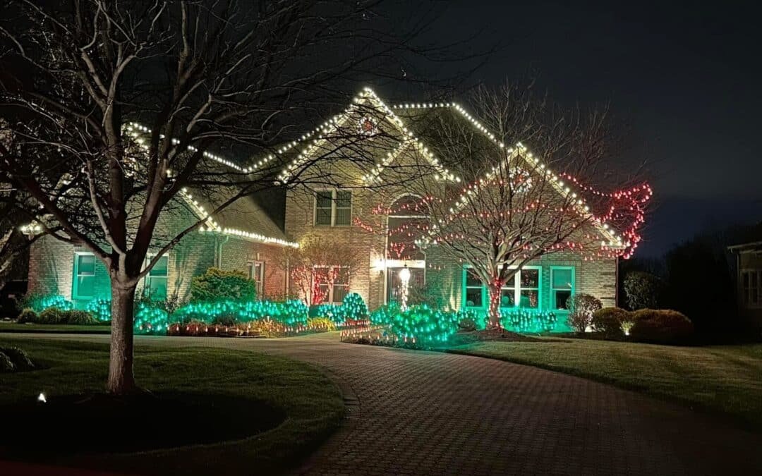Designer planning a custom holiday light layout for a home in Tarrant County, TX