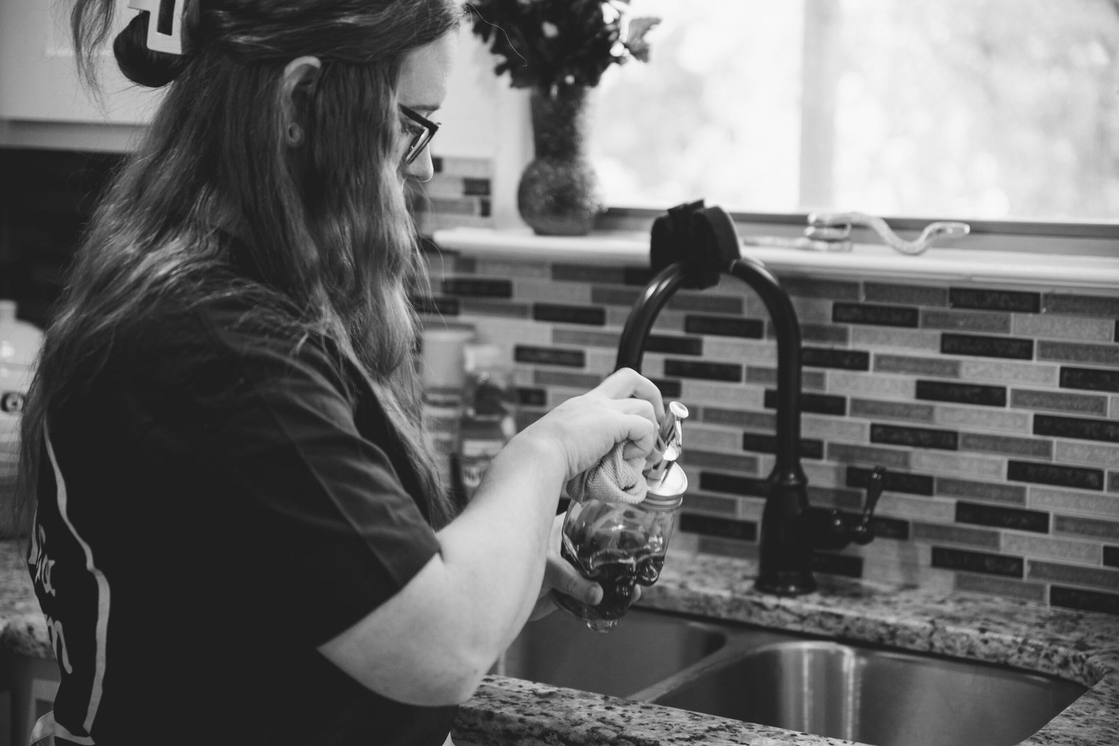 Professional cleaning service in Saginaw by The Mop & Broom, washing kitchen utensils.