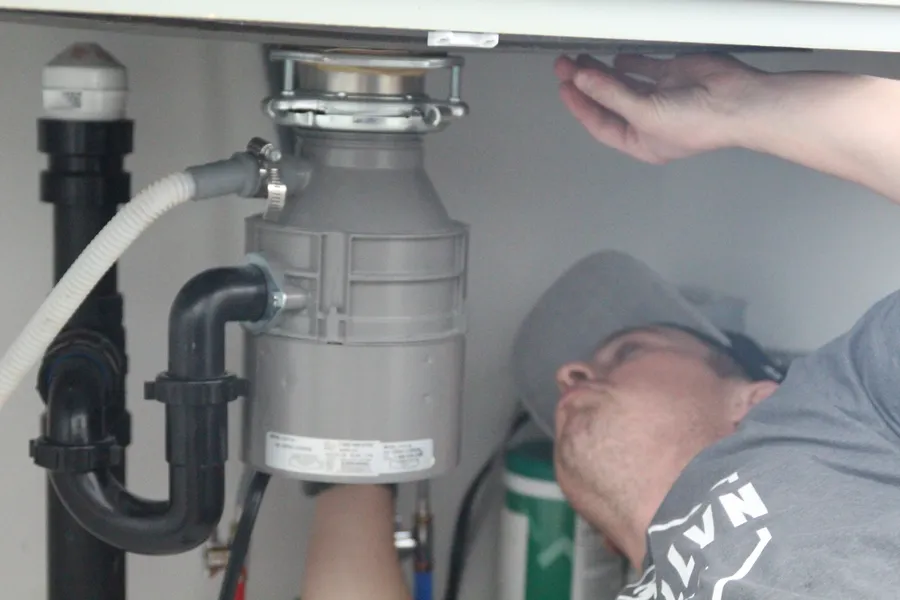 Llewellyn plumber installing a garbage disposal