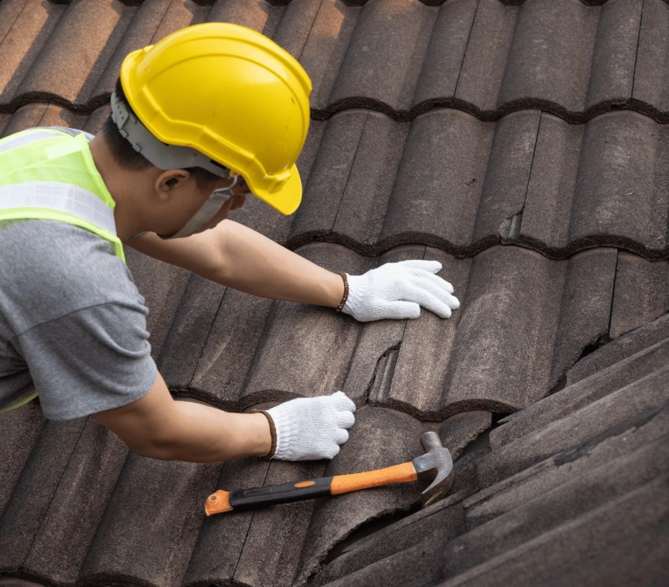 Roofing crew applying underlayment and flashing during residential install