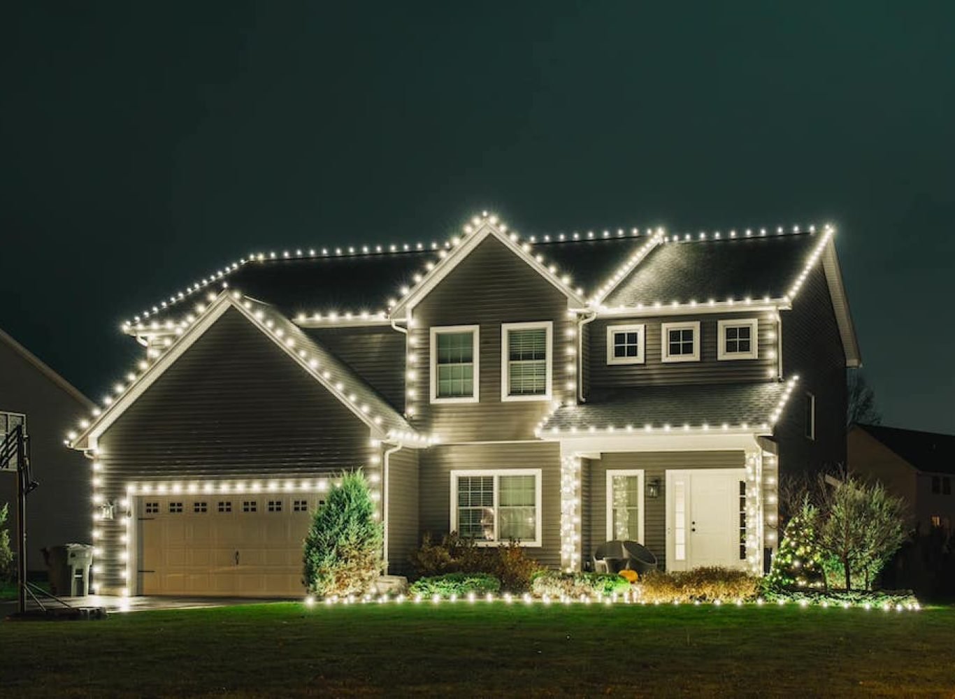 Designer planning a custom holiday light layout for a home in Tarrant County, TX